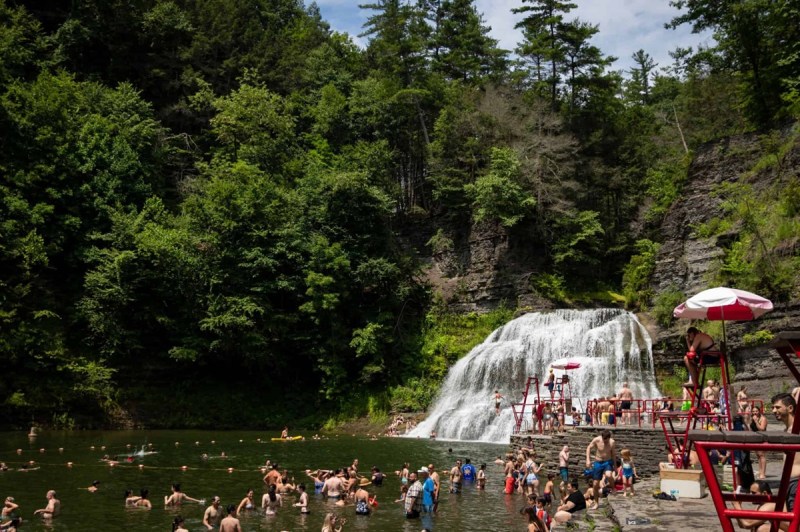 Beneath Enfield Falls, a stream-fed natural pool with amenities like a diving board, one of New York's many swimming holes