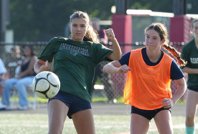 An action shot from a Westchester girls soccer summer league match