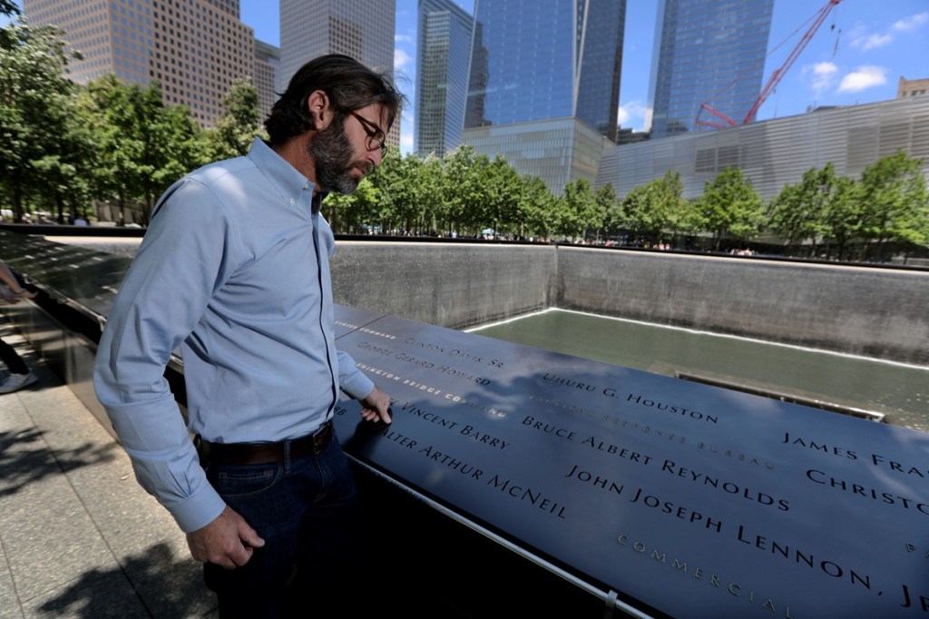 Man stands at 9/11 memorial