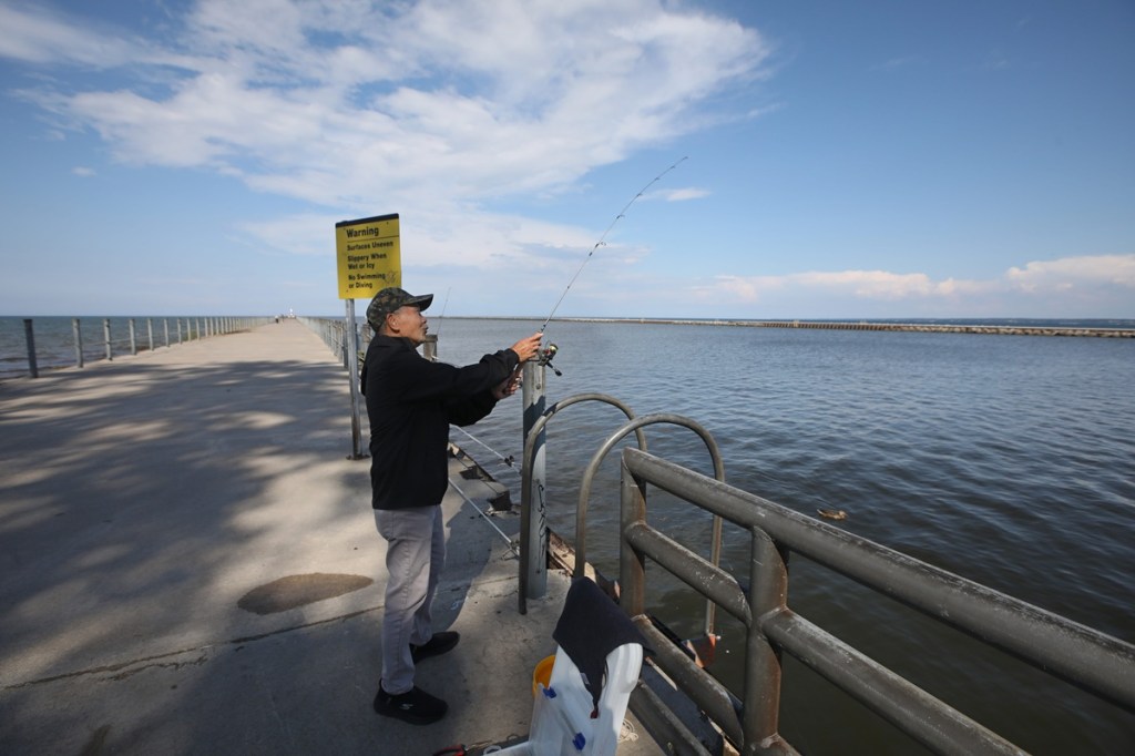 A fisherman on the Ontario County side of Lake Ontario