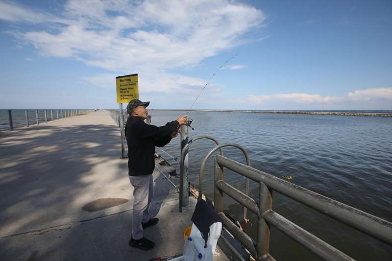 A fisherman on the Ontario County side of Lake Ontario